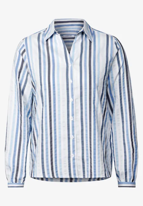 Bluse mit blauen und weißen vertikalen Streifen, Knopfleiste und langem Arm.